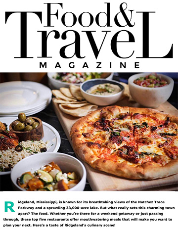 Charcuterie board and assorted dishes, some with food and some without. Text: Food and Travel Magazine. Ridgeland, Mississippi, is known for its breathtaking views of the Natchez Trace Parkway and a sprawling 33,000-acre lake. But what really sets this charming town apart? The food. Whether you're there for a weekend getaway or just passing through, these top five restaurants offer mouthwatering meals that will make you want to plan your next. Here's a taste of Ridgeland's culinary scene!