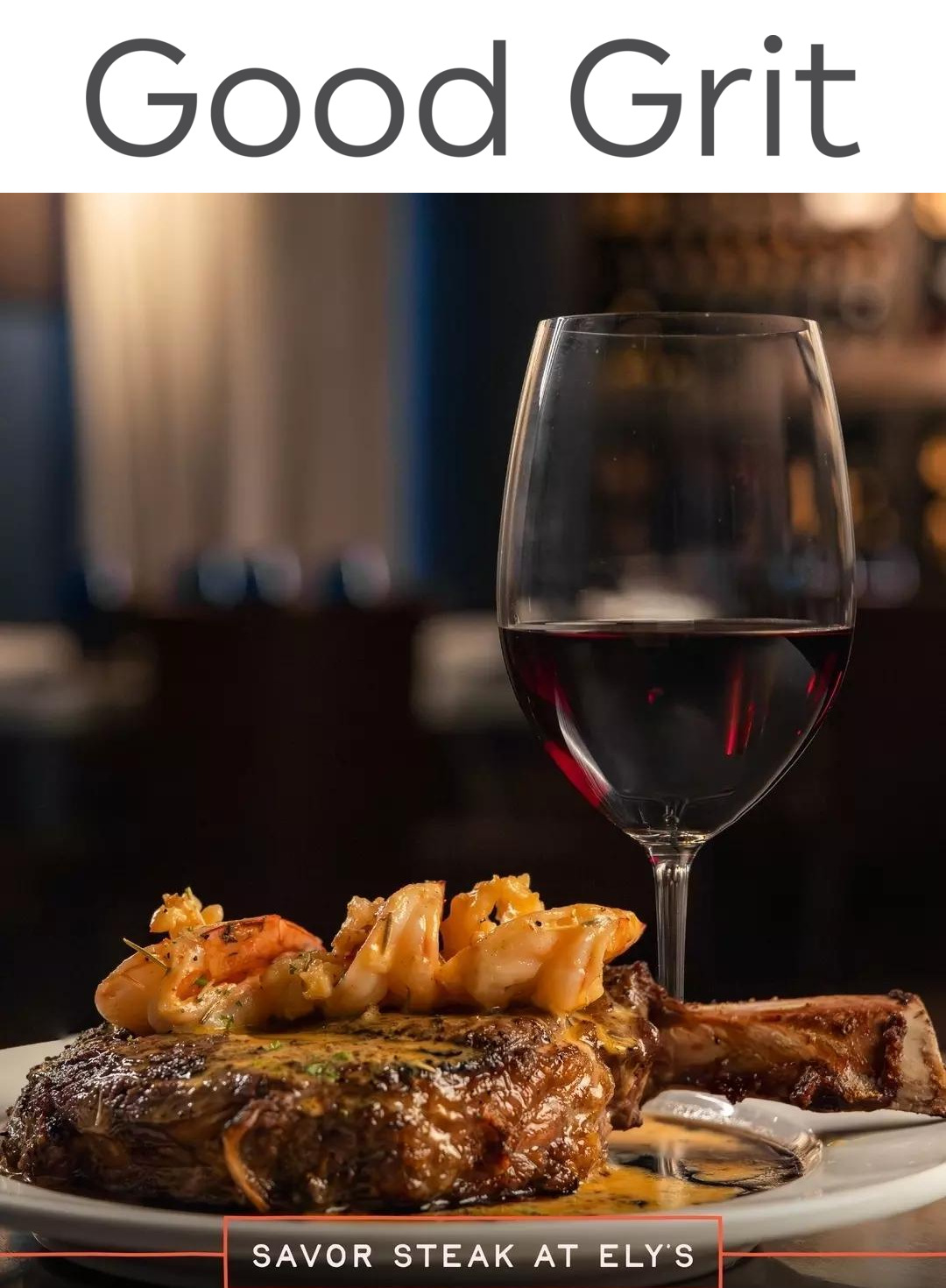 steak topped with shrim and sauce, accompanied by glass of wine. Text: Good Grit